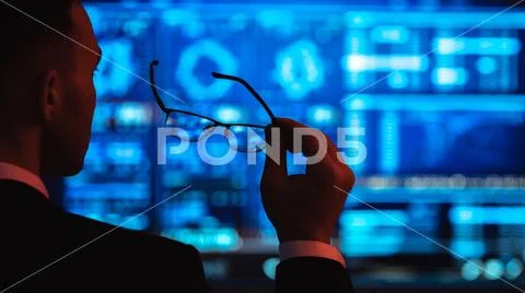 The businessman holding glasses on the screen background Stock Photos