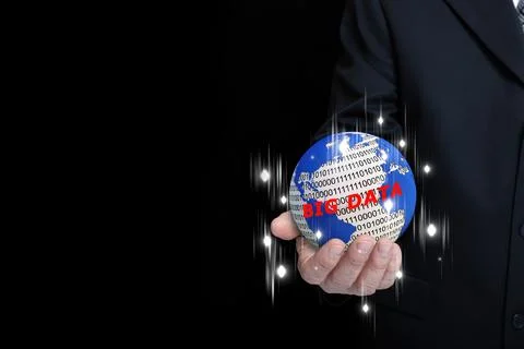 A businessman holding a globe with map, binary numbers, big data text, and st Stockfoto's