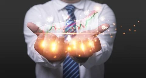Businessman holding graph virtual for analyzing sales data and business gro.. Stock Photos