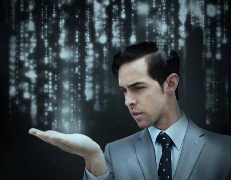 Businessman holding hand out over matrix Stock Photos