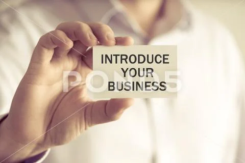 Businessman holding INTRODUCE YOUR BUSINESS card Stock Photos