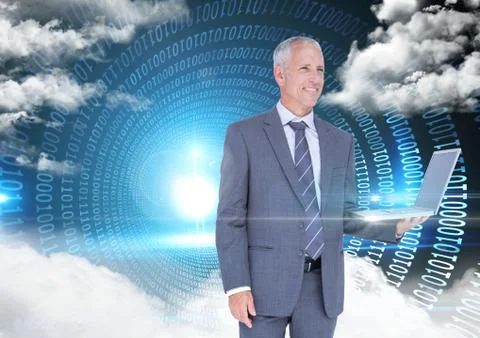 Businessman holding laptop with binary codes and clouds in background Stock Photos