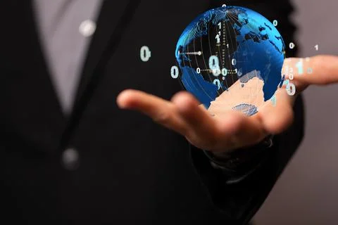 Businessman holding a render of a globe with binary code- global network 스톡 사진