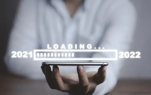 Businessman holding smartphone with loading progress bar for New Year's Eve Stock Photos