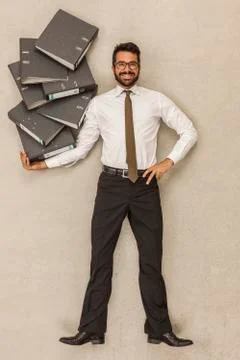 Businessman holding stack of files 스톡 사진