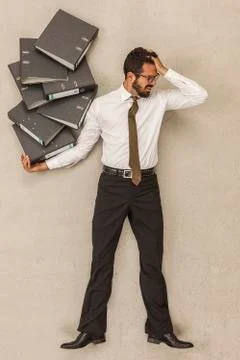 Businessman holding stack of files 스톡 사진
