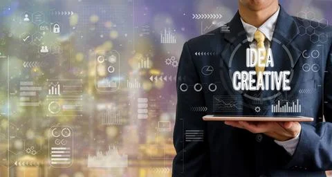 Businessman holding a tablet computer idea creative icon graph abstract bac.. Stock Photos