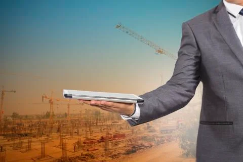 Businessman  holding a tablet computer Stock Photos