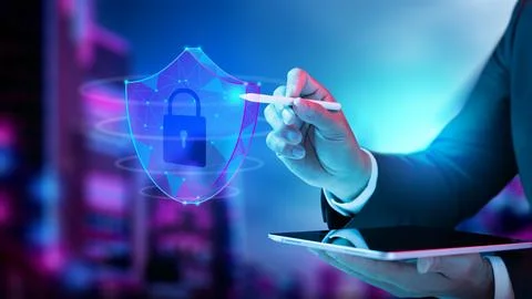 Businessman holding tablet while touching wireframe shield with padlock ico.. 스톡 사진