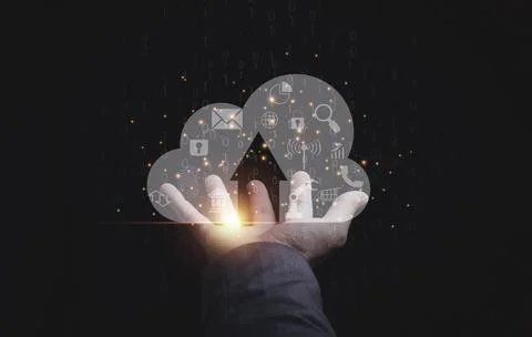 Businessman holding virtual cloud computer with icons for download and upload Stock Photos