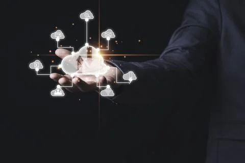 Businessman holding virtual cloud computing with connect to technology icons Stock Photos