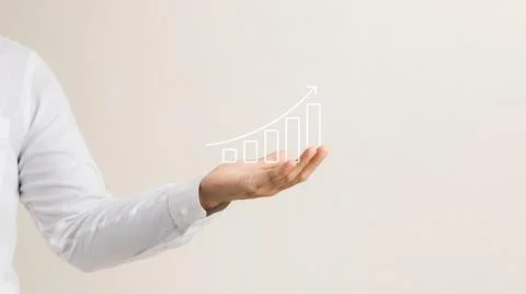 Businessman holding virtual graph, graph analysis of business growth and inve Stock Photos