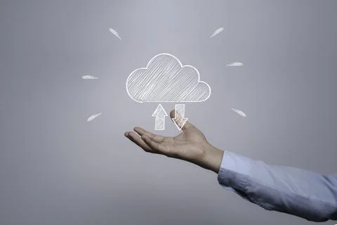 Businessman holding white cloud computing icon from hand drawing Foto stock