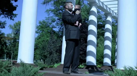 Businessman holds on hands his child  Stock Footage 59088175