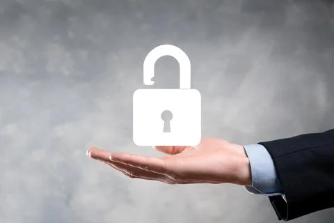 Businessman holds an open padlock icon on his palm.unlocking a virtual lock.  Foto stock