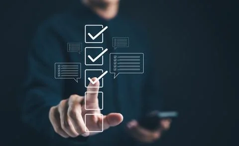 Businessman interacting with digital checklist interface. Correct sign mark. Stock Photos