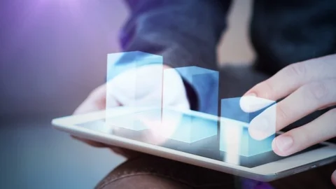 Businessman interacts with hologram chart on a tablet Stock Footage 114366982