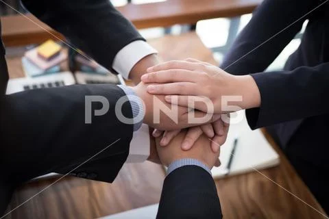 Businessman joining hand, business team touching hands together - unity, harm Stock Photos