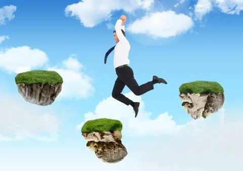 Businessman jumping between steps of floating rock platforms in sky Stock Photos