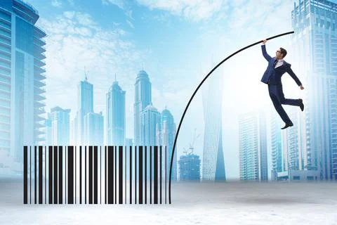 Businessman jumping over bar code in pole vaulting Stock-Fotos