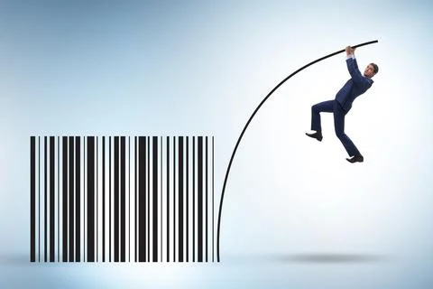 Businessman jumping over bar code in pole vaulting Foto stock