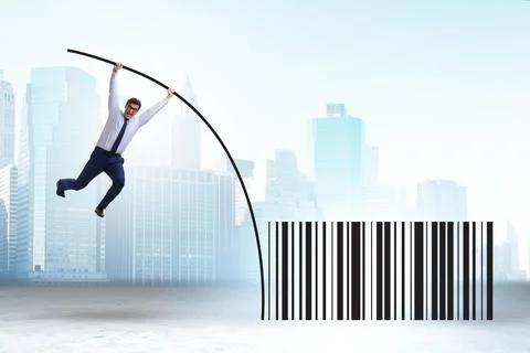 Businessman jumping over bar code in pole vaulting 写真素材
