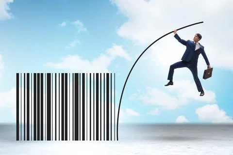 Businessman jumping over bar code in pole vaulting 写真素材