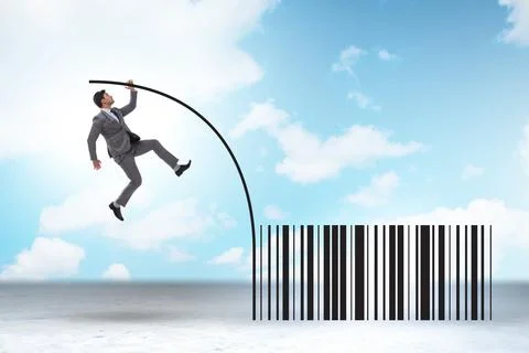 Businessman jumping over bar code in pole vaulting 写真素材