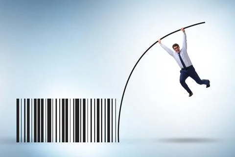 Businessman jumping over bar code in pole vaulting Foto stock