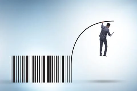 Businessman jumping over bar code in pole vaulting 写真素材