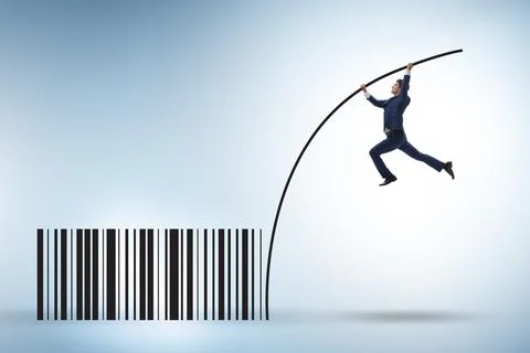 Businessman jumping over bar code in pole vaulting Foto stock