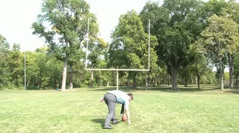 Businessman Kicks Field Goal Stock Footage