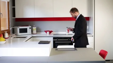 Businessman in the kitchen Stock Footage 109398829