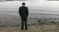 Businessman by the lake. HD Footage