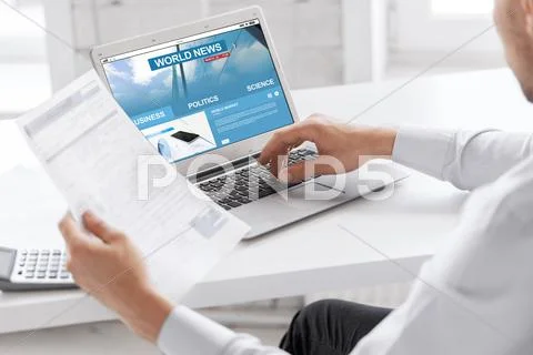 Businessman with laptop computer working at office Stock Photos