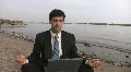 Businessman with laptop meditates. HD Footage