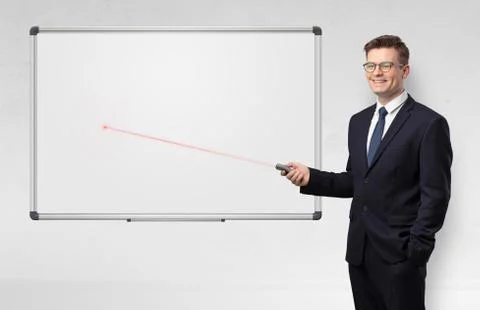 Businessman with laser pointer and copyspace white blackboard Stock Photos