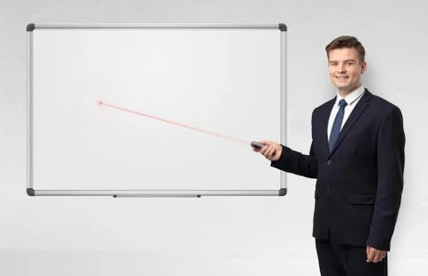 Businessman with laser pointer and copyspace white blackboard Stock Photos