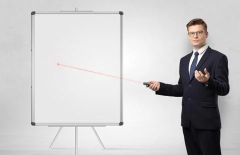 Businessman with laser pointer and copyspace white blackboard Stock Photos