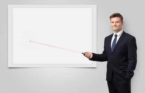 Businessman with laser pointer and copyspace white blackboard Stock Photos