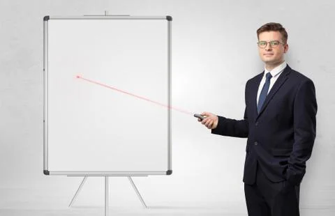 Businessman with laser pointer and copyspace white blackboard Stock Photos