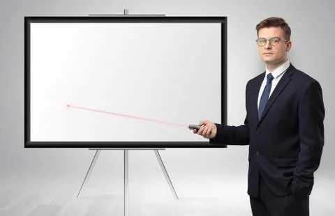 Businessman with laser pointer and copyspace white wall Stock Photos