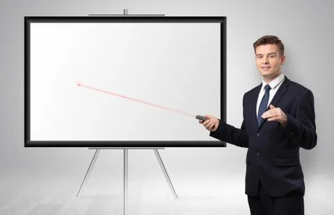 Businessman with laser pointer and copyspace white wall Stock Photos
