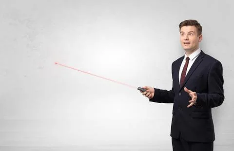 Businessman with laser pointer and copyspace white wall Stock Photos