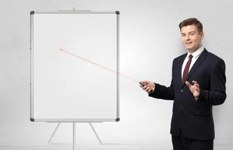 Businessman with laser pointer and copyspace white blackboard Stock Photos