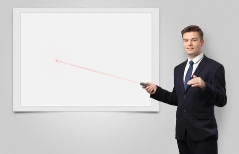 Businessman with laser pointer and copyspace white blackboard Stock Photos
