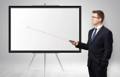 Businessman with laser pointer and copyspace white wall Stock Photos