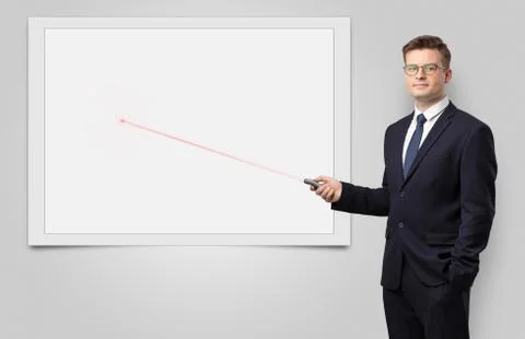 Businessman with laser pointer and copyspace white blackboard Stock Photos