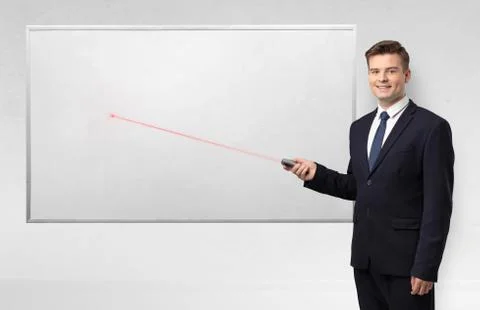 Businessman with laser pointer and copyspace white blackboard Stock Photos