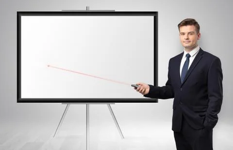 Businessman with laser pointer and copyspace white wall Stock Photos